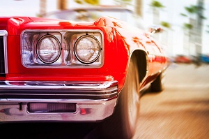 front of a red classic car