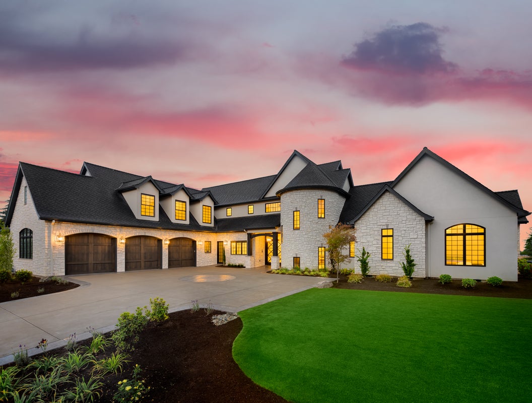 a house with trees in the background